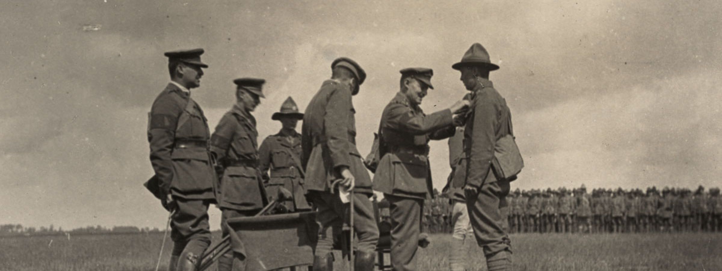 General Russell awards a soldier a medal  for gallantry - earned in the fighting at Meteren, France 1918.